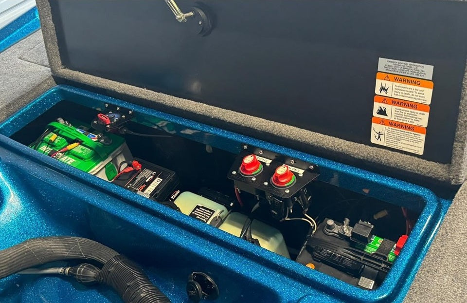 Universal dual battery switch mounting bracket installed in a bass boat