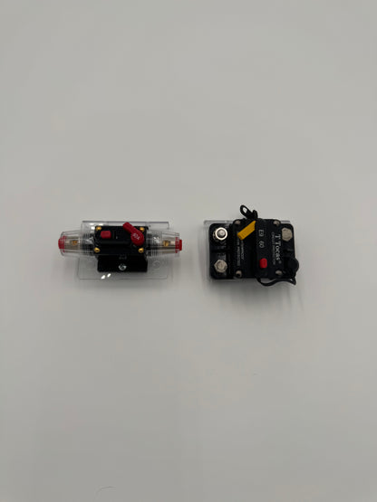 two bass boat circuit breaker switches mounted to a clear plastic mounting bracket