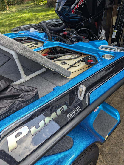 Bass Cat Puma Caracal Double Battery Switch corner bracket, black dual-switch mount installed in blue boat compartment
