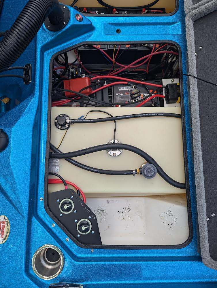 Bass Cat Puma Caracal Double Battery Switch bracket with two black rotary switches mounted in a blue boat compartment