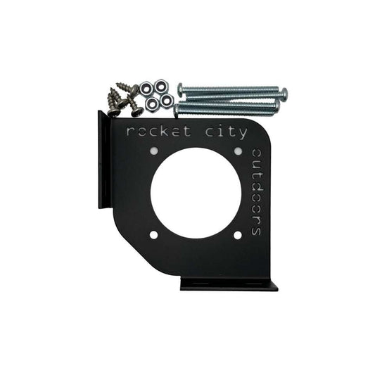 Battery switch corner bracket in matte black aluminum, with a circular switch opening and mounting flanges