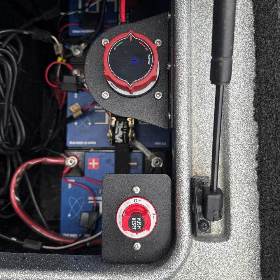 Egis 4701 Circuit Breaker Bracket in matte black aluminum, mounted beside battery switches with a red breaker control