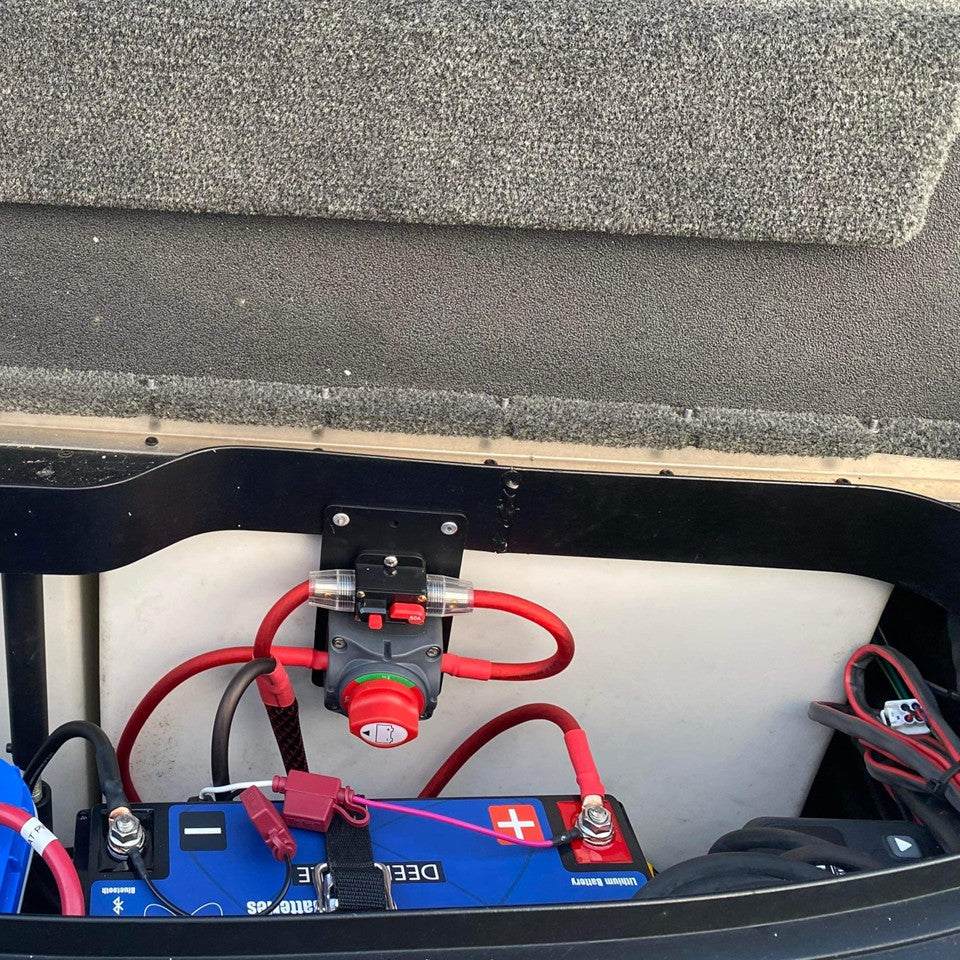 Flat Bass Boat Battery Switch bracket with mounted red rotary switch above a blue battery and connected red cables