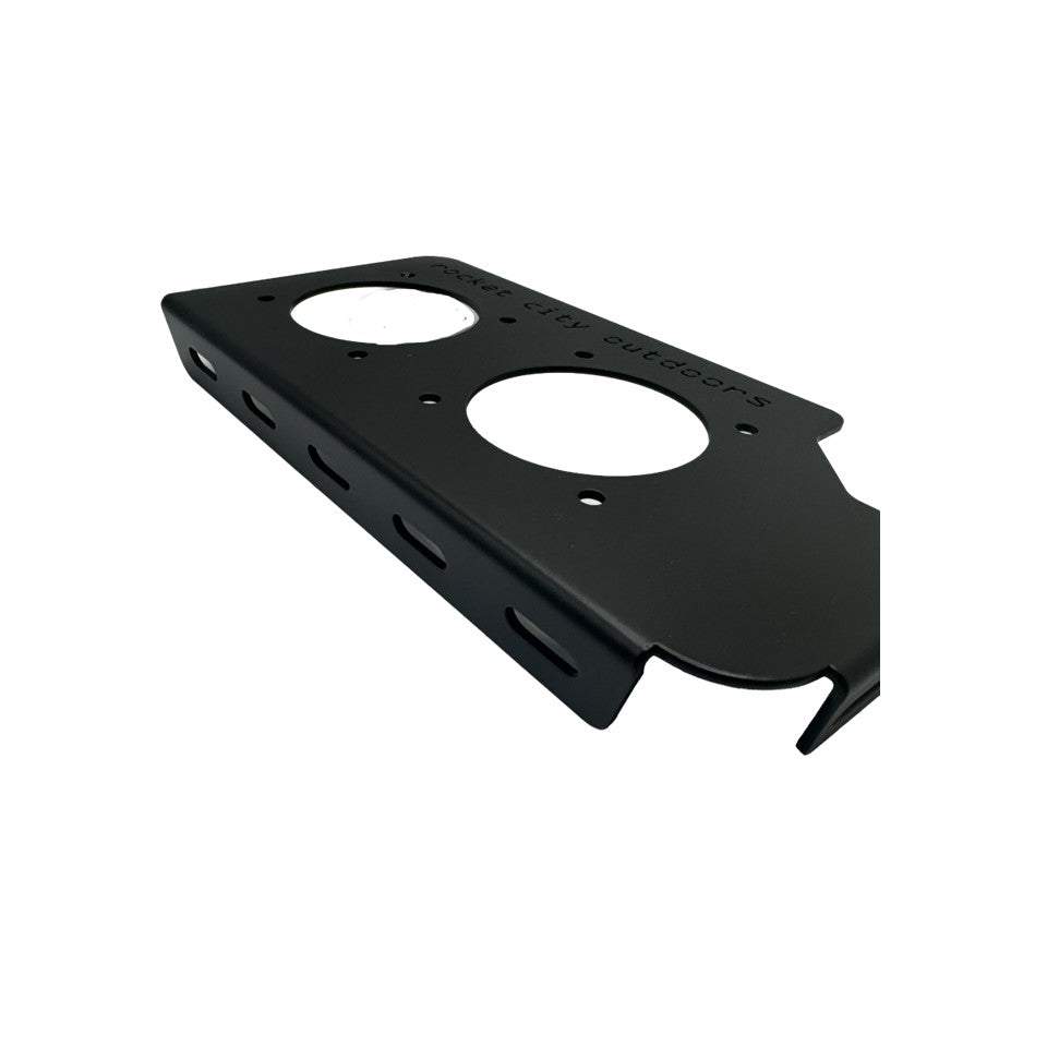Phoenix Double Battery Switch corner bracket in matte black powder-coated aluminum, with two circular switch openings and slotted sides