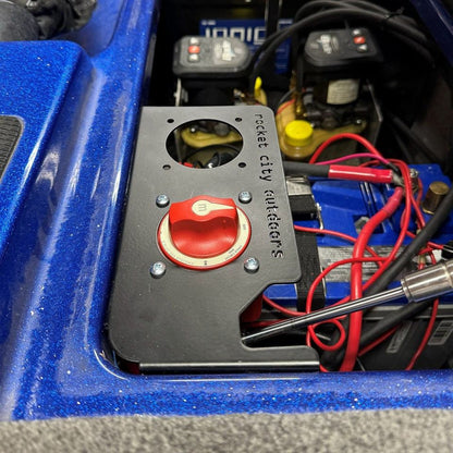 Phoenix Double Battery Switch bracket, matte black metal panel with a red rotary switch and circular mounting openings