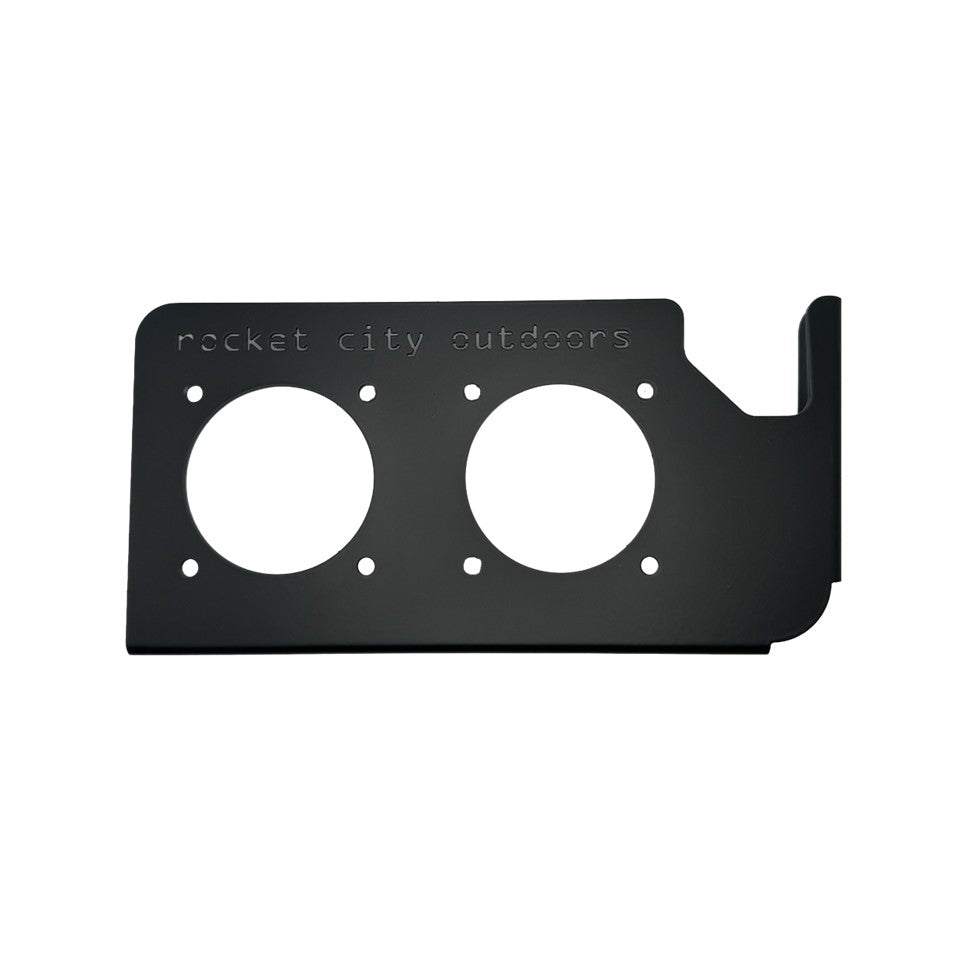 Phoenix Double Battery Switch mounting bracket in matte black aluminum with two circular switch openings and a raised corner lip