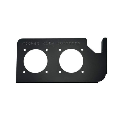 Phoenix Double Battery Switch mounting bracket in matte black aluminum with two circular switch openings and a raised corner lip