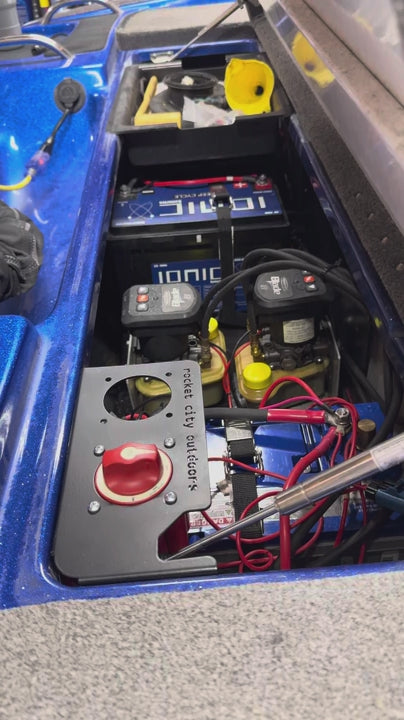 compartment lid closing on a dual corner battery switch mounting bracket for phoenix bass boats