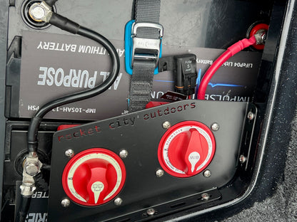 Close-up of a bass boat battery management system with blue sea systems switches
