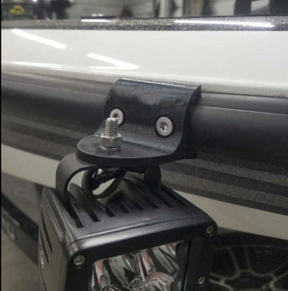 Rub Rail Headlight Mount black weather-resistant bracket securing a square LED light fixture to a boat rub rail
