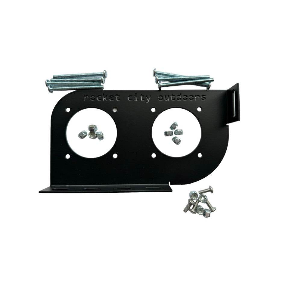 Skeeter Dual Battery Switch mounting bracket in matte black metal, with two circular switch cutouts and silver mounting hardware.