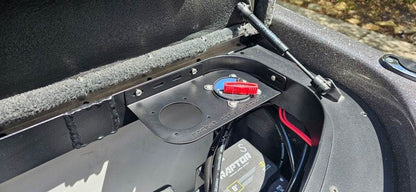 Skeeter dual battery switch bracket in matte black, mounted in a boat compartment with one red switch installed and a second opening.