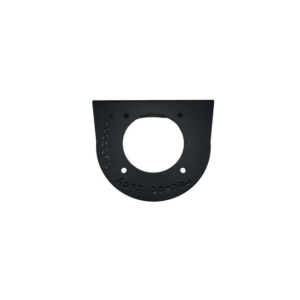 Universal battery switch mounting bracket, matte black powder-coated metal plate with a circular switch opening and mounting holes.